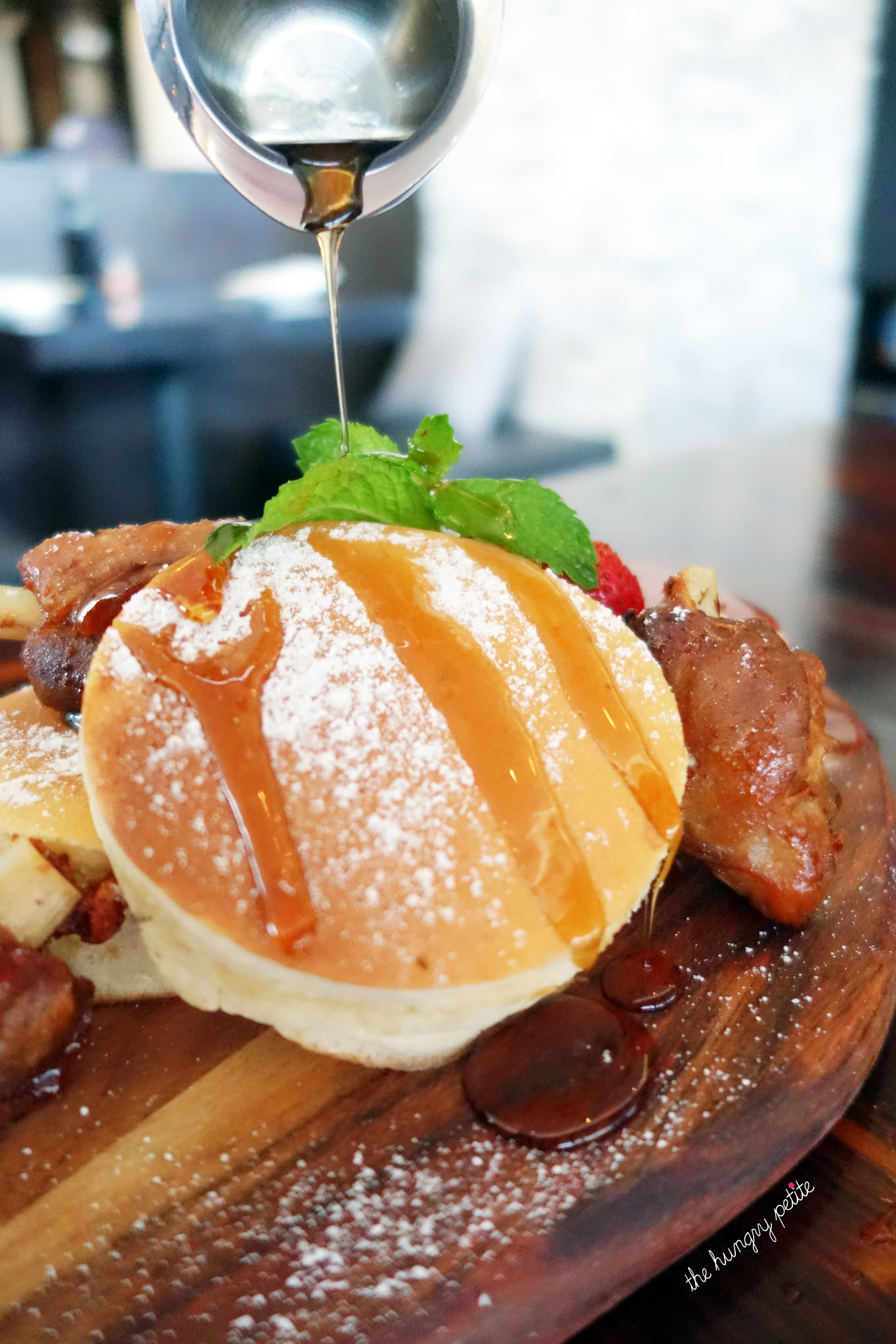 Japanese pancakes with pork wings, plain maple syrup and Sriracha syrup