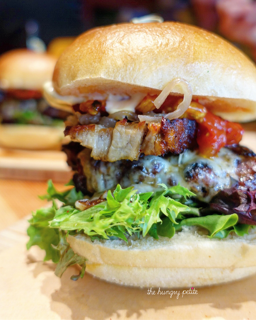 Blockalicious Burger - Alberta Beef House patty, pork belly, roasted tomatoes, onion compote, Japanese mayo, smoked cheddar - from Block Kitchen & Bar
