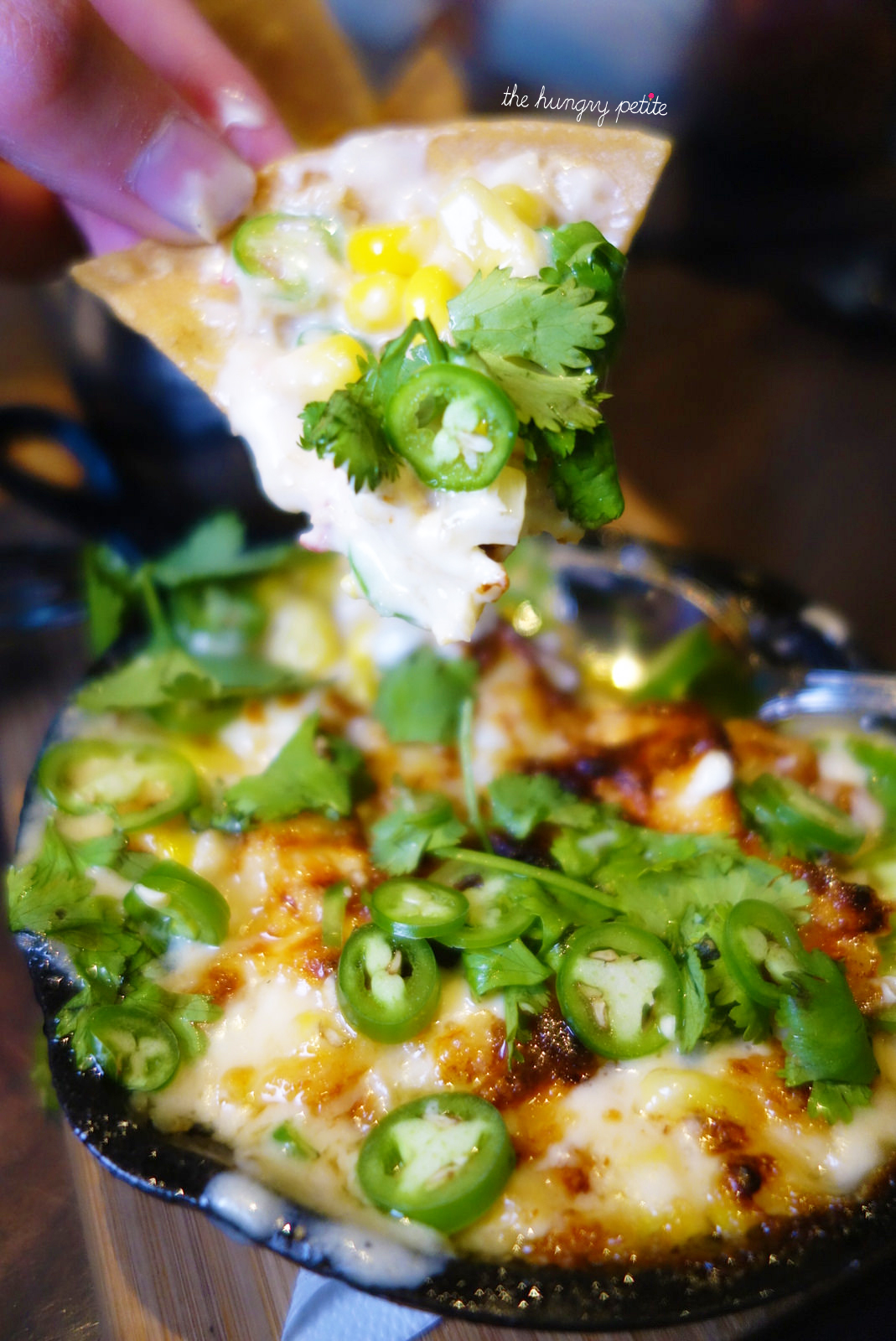 Crab & Corn Fundido, goat gouda, asiago, cilantro, lime, corn chips - from Crazy Weed Kitchen in Canmore
