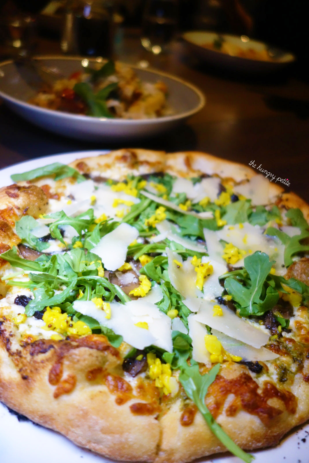 Forest Mushroom pizza - cremini, truffle, pesto, arugula, picked garlic, parm - from Crazy Weed Kitchen in Canmore