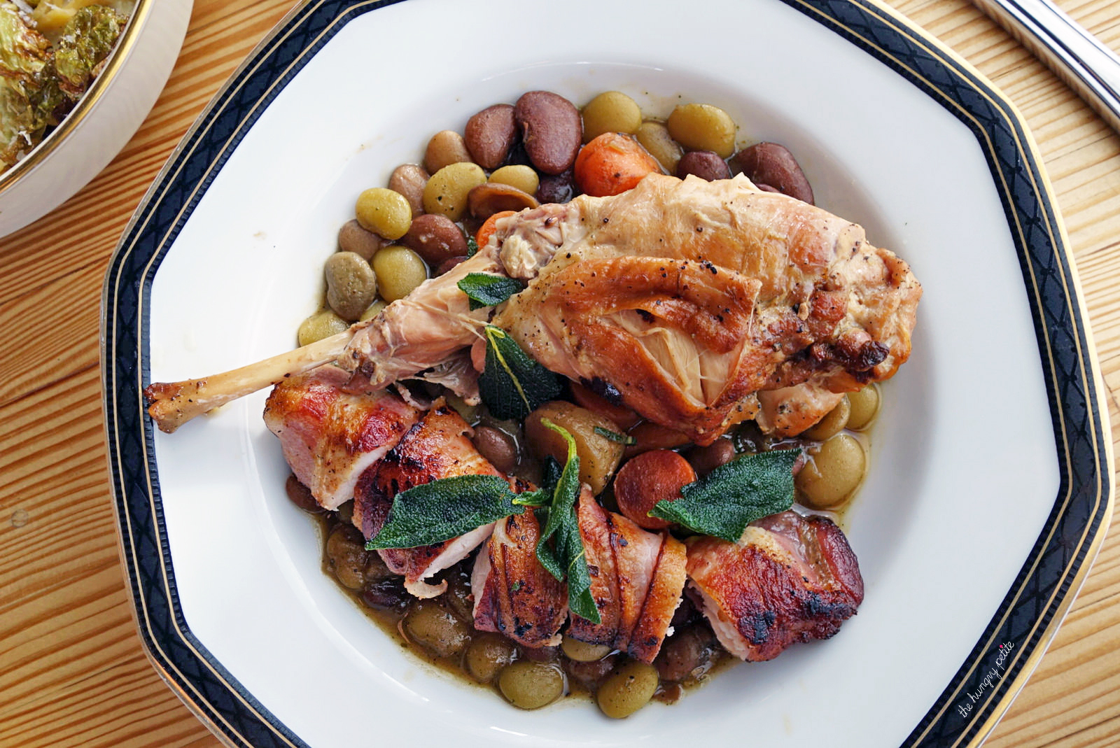 Braised Rabbit Leg & bacon-wrapped rabbit loin, braised beans and sage. Tender and delicious.