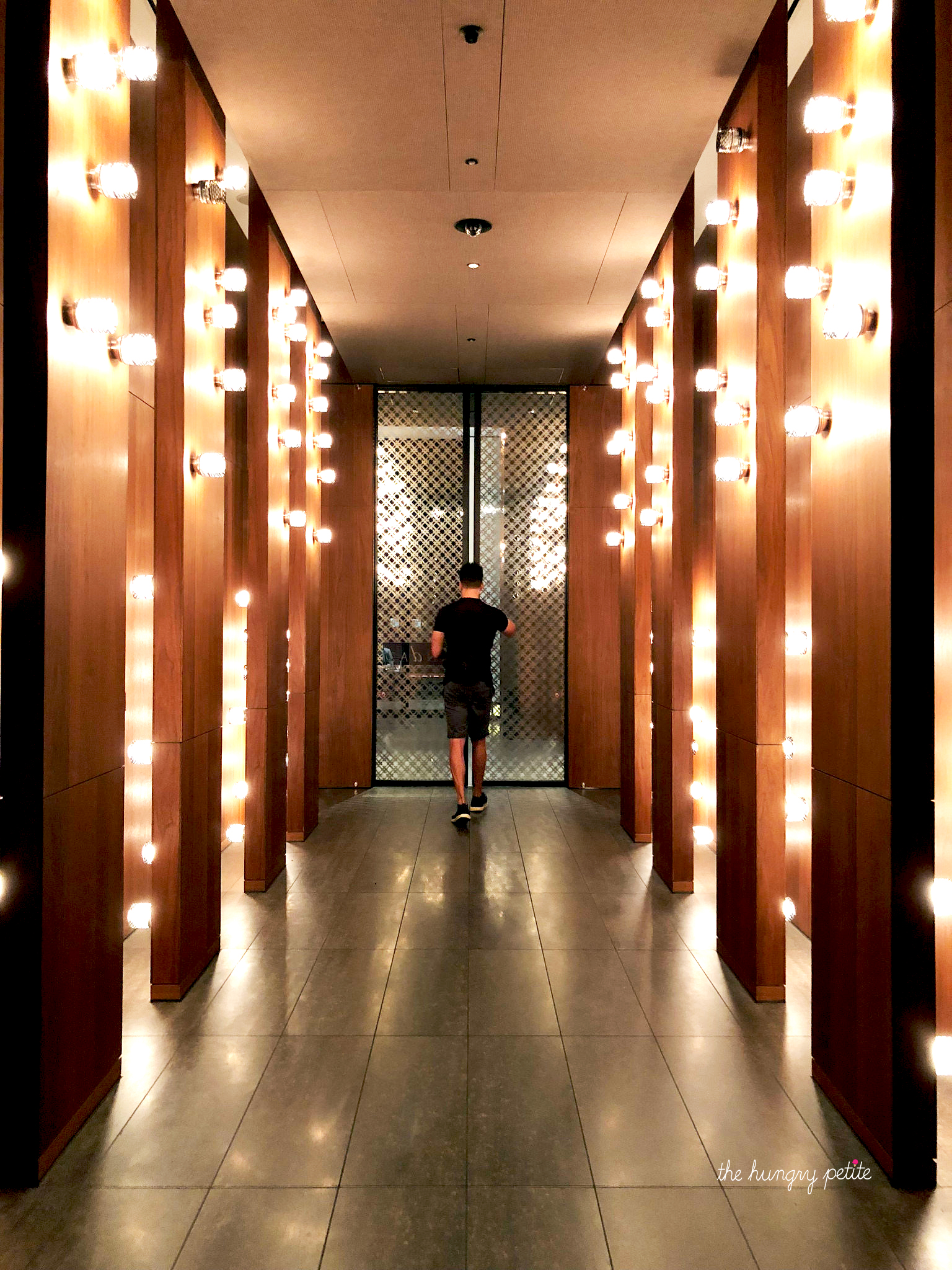 The Andaz Tokyo is inside the Toranomon Hills building. The building is home to business offices, restaurants, and retail space. After you pass through a glass sliding door, this is the hallway to the Andaz elevator.