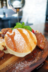 Japanese pancakes with pork wings, plain maple syrup and Sriracha syrup