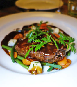 Venison steaks with potato gratin and red port sauce