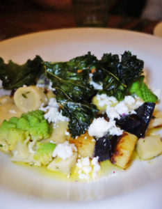 Gnocchi with forgotten vegetables, feta cheese and kale chips