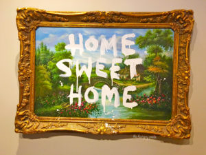 Home Sweet Home - Banksy spray-painted on top of another artist's work