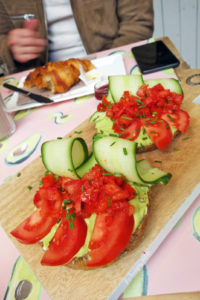 Sis in law's Avocado Smash - 2 toasts with avo, cucumber, tomato and homemade sauce