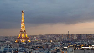 After sunset while the Eiffel Tower is sparkling with lights