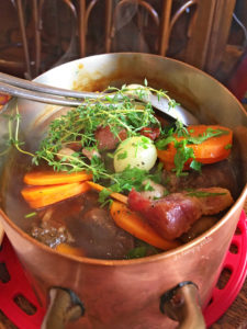 Braised beef cheek with red wine, charlotte potatoes, bacon, mushrooms, grilled onions, carrots, thyme