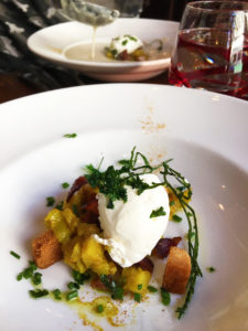 Velouté with two celery, cream quenelle with olive oil curry chutney, bacon, parsley fried croutons and chives