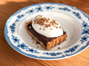 Chocolate Tart, grapefruit cream & candied buckwheat.