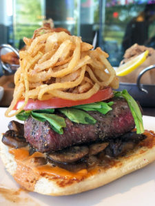Butcher's Cut Steak Sandwich- open faced with sautéed mushrooms, caramelized & crispy onions, sriracha bbq sauce, fresh arugula, garlic ciabatta. Loved this and the crispy onions on top. $18.75